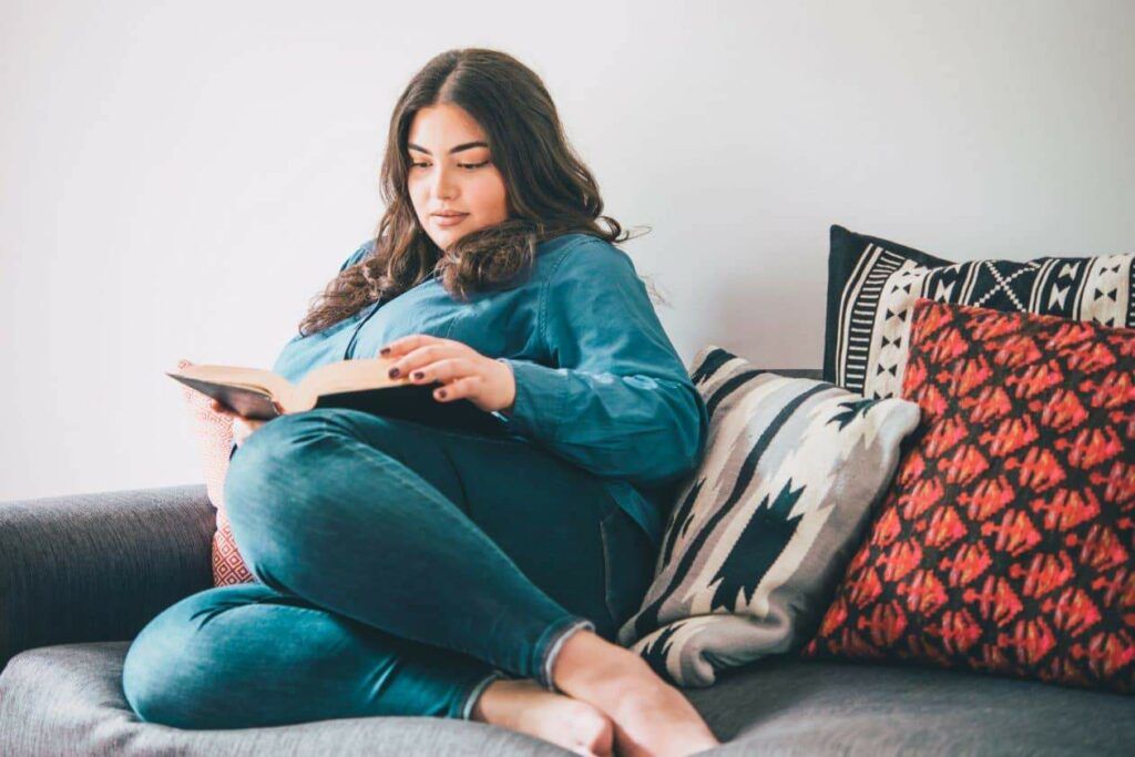plus size woman reading just our luck by denise williams